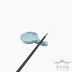 Posapinceles con tintero azul